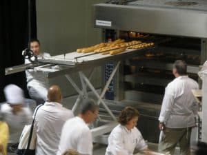 Didier Rosada pulling some of the Artisan 101 breads out of the oven