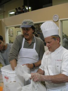 Jeff Hammelman and a camper mixing up the flax seed and old bread soaker