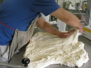 The dough gets stretched again