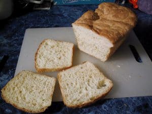 Sourdough English Muffin Bread, sliced on a cutting board