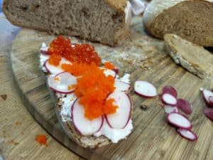 goat cheese radish and roe sandwich