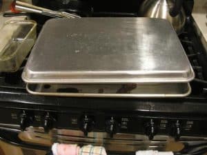 To get the rolls out, put another sheet pan on top, flip the mess over, and then remove the formerly bottom pan.