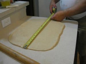It is a 20 x 24 inch rectangle,. This will take some work – keep at it! If the dough gets stubborm, cover it and let it rest 15 minutes or so.