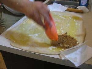 Spread the cinnamon and brown sugar mix to absorb the butter before it's all over your table