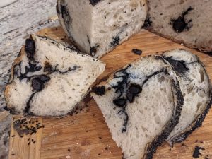 Sliced black garlic and charcoal bread